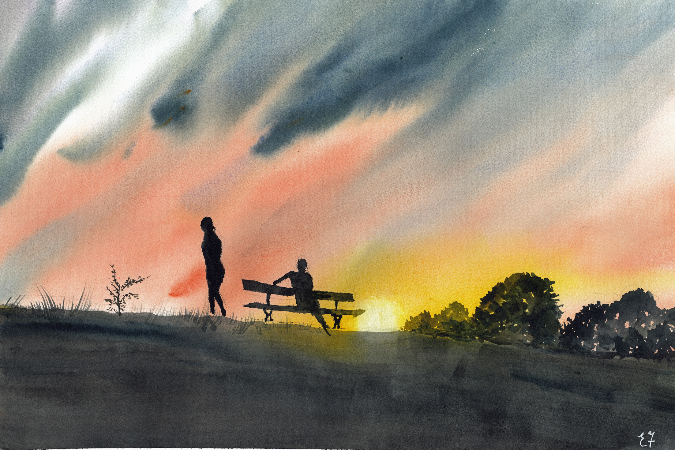 Two people in the park at sunset