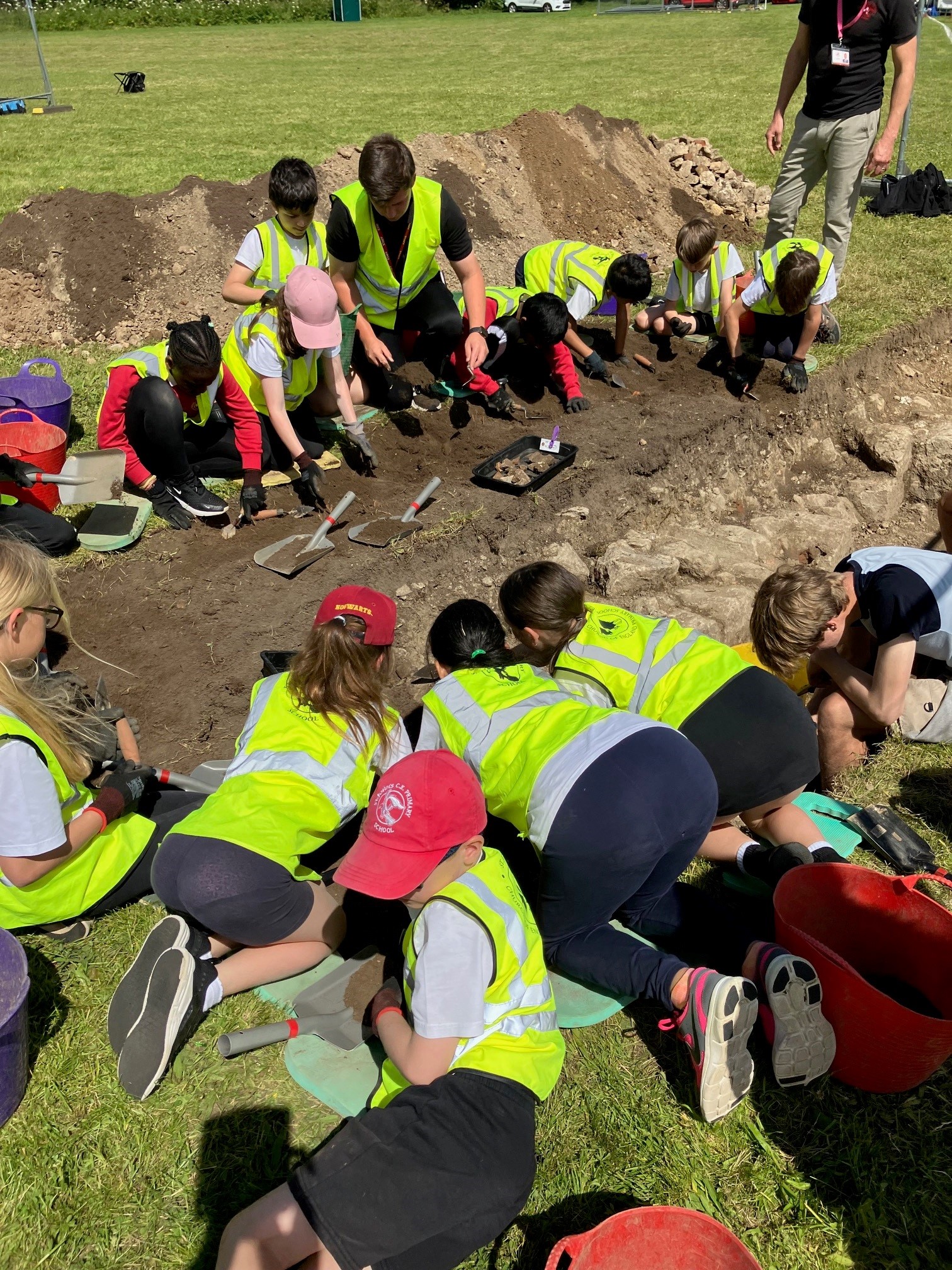 School children getting involved in an archaeological dig